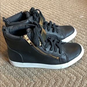 Black hi top sneakers with gold trims